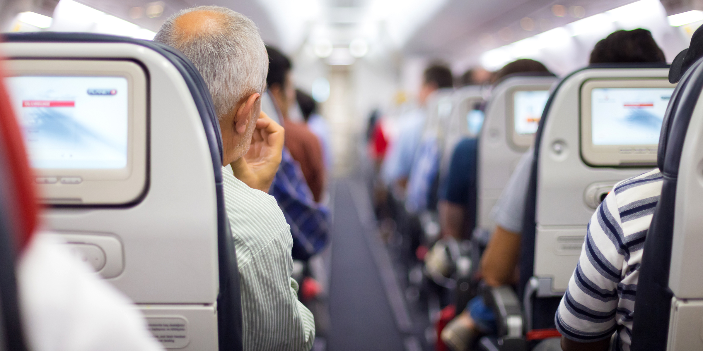 Airplane passengers | Source: Shutterstock