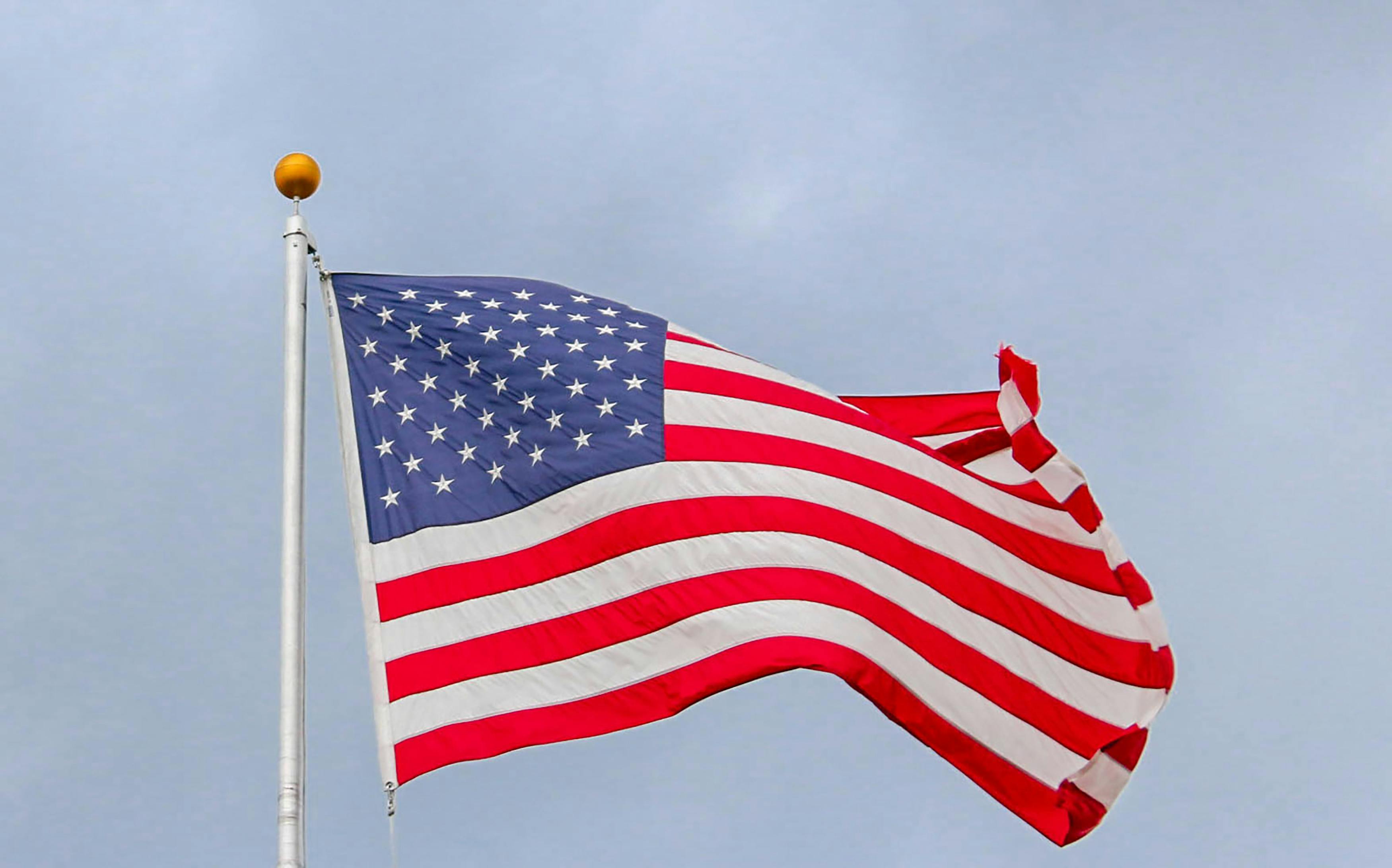 The USA flag on a metal pole | Source: Pexels