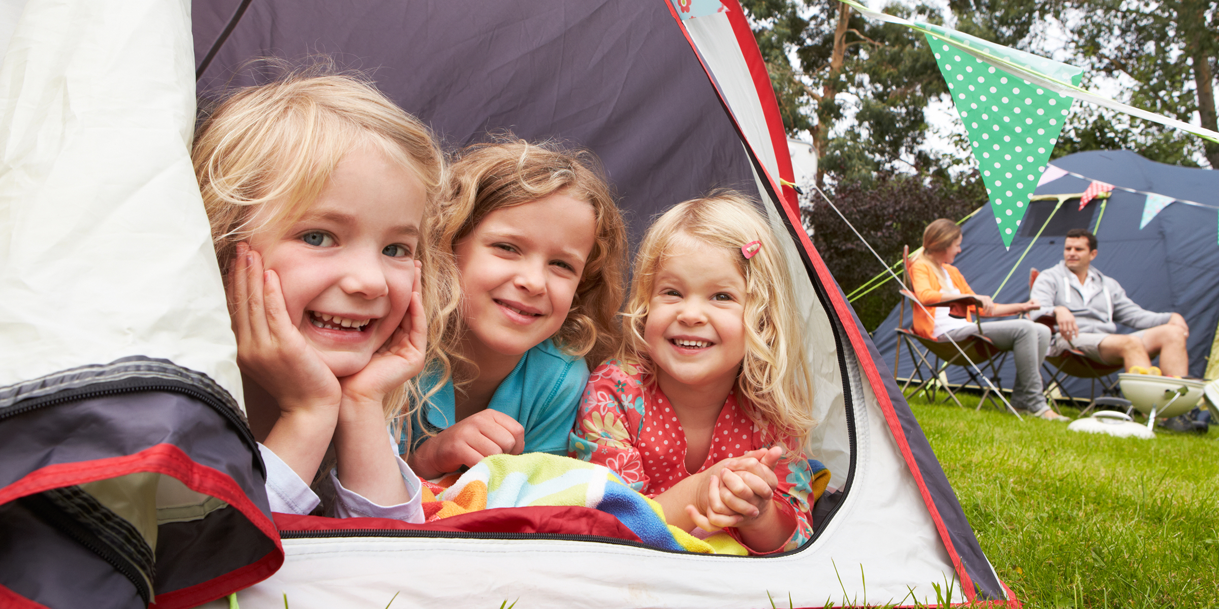Children at a camp with their parents | Source: Shutterstock