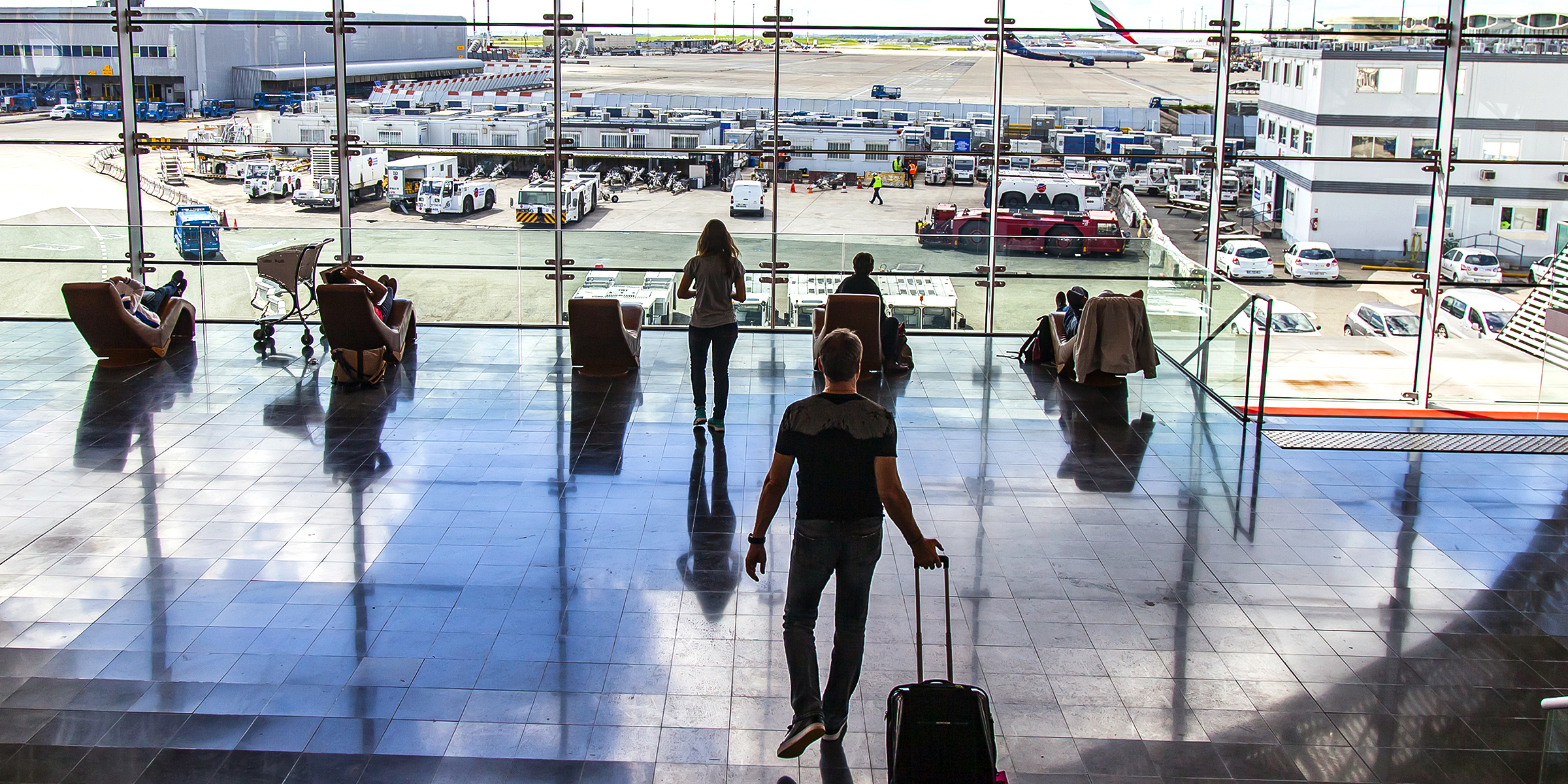 Travelers at Charles de Gaulle Airport | Source: Shutterstock